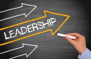 Leadership Concept Chalkboard with female hand